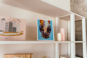 freckled painting print on shelf